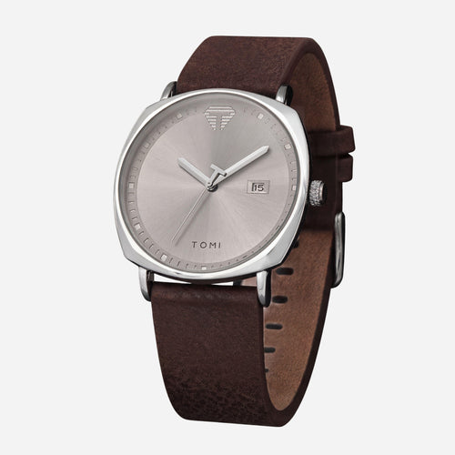 Watch with brown leather strap and silver case on a white background
