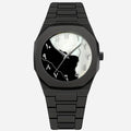 Black wristwatch with a unique face design on a light gray background