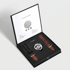Watch set with two straps in a TOMI box on a light gray background