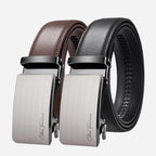 Three belts with silver buckles on a light gray background