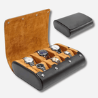 Watch case with six slots containing watches, one of which is open to reveal the contents.