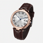 Watch with brown leather strap and rose gold case on white background