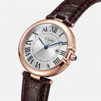 Watch with brown leather strap and rose gold case on white background