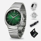 Silver watch with green face and additional accessories on a white background