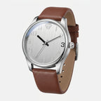Watch with brown leather strap and silver case on a white background
