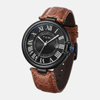 Watch with brown leather strap and black dial on a light gray background