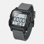 Digital watch with gray strap on a light gray background