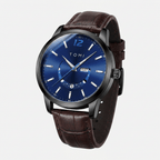Watch with blue dial and brown leather strap on a light gray background
