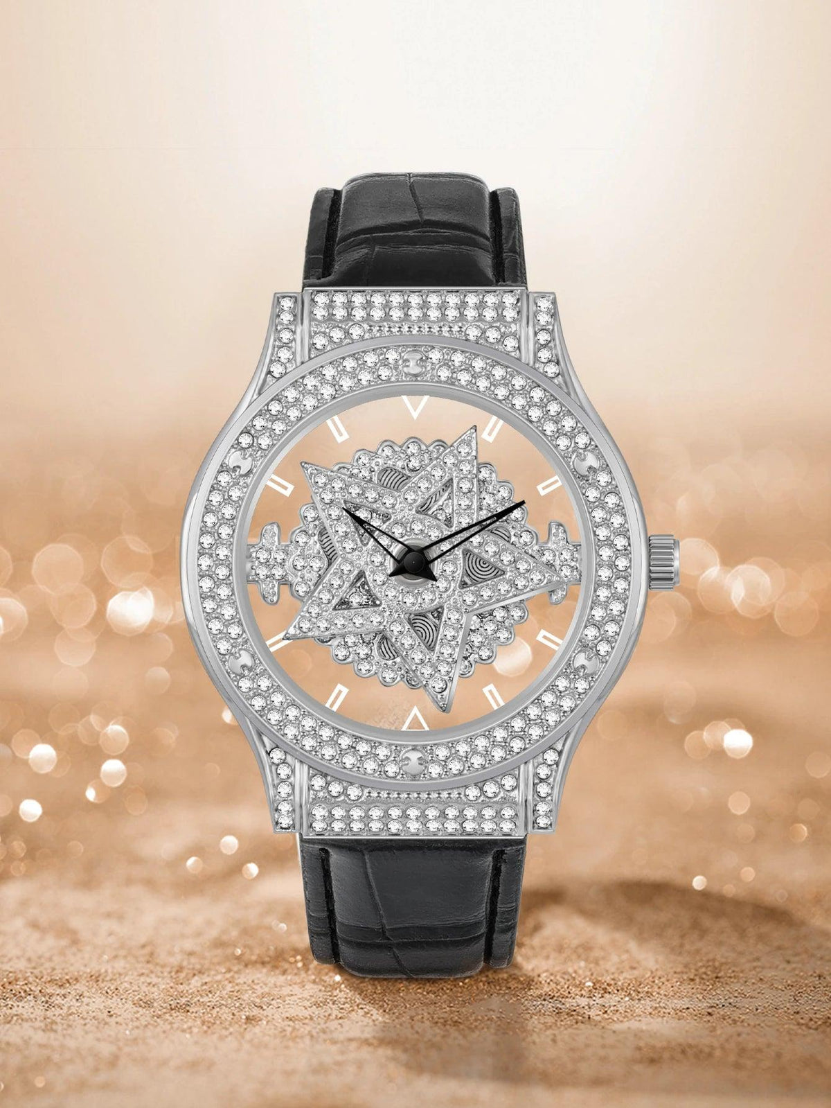 Luxury watch with black leather strap and silver case on a blurred background
