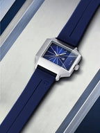 Wristwatch with blue strap and blue dial on a metallic background