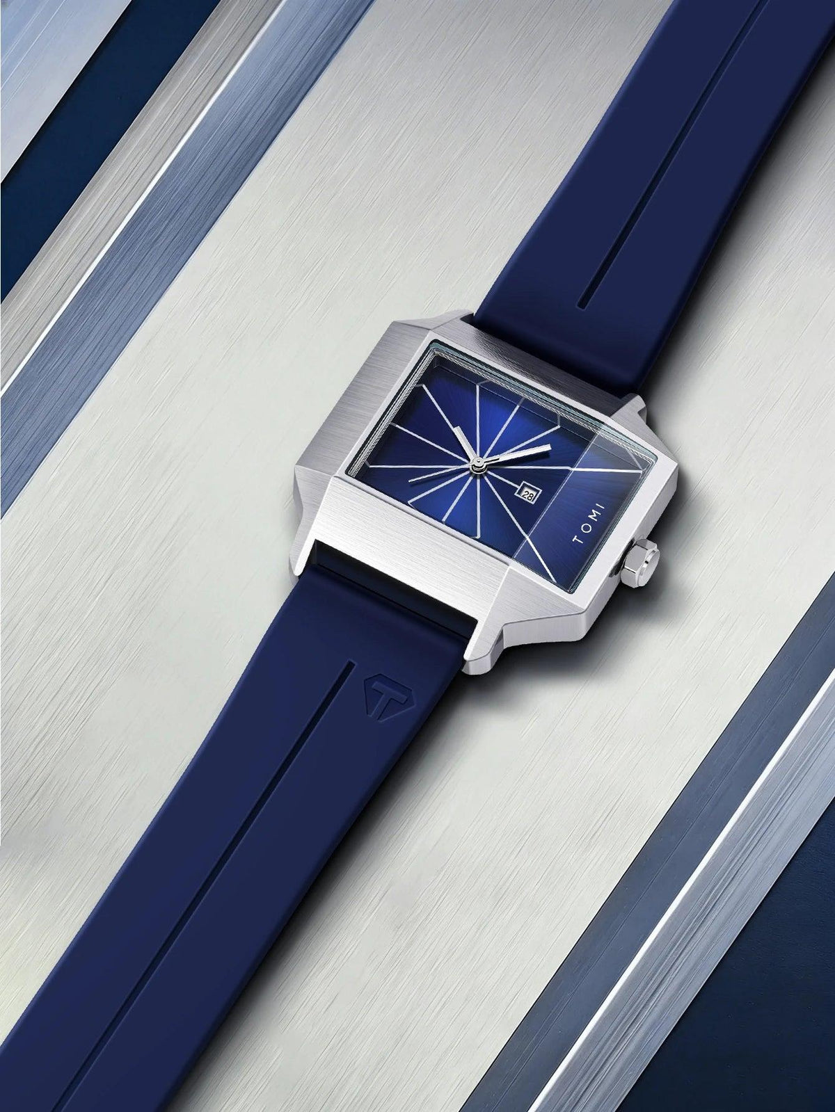 Wristwatch with blue strap and blue dial on a metallic background