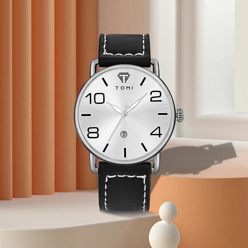 Black wristwatch with silver case on a neutral background
