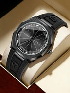 A black Tomi analog watch with a carbon-fiber-textured case, black dial, and black rubber strap, displayed inside a cream-colored watch box.