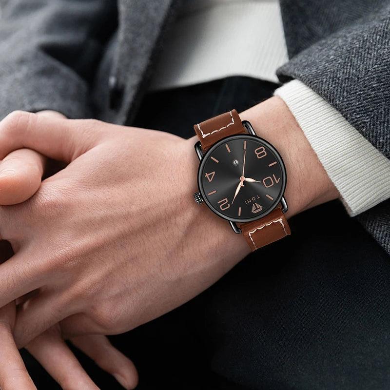 Person wearing a watch with a brown leather strap and black dial.
