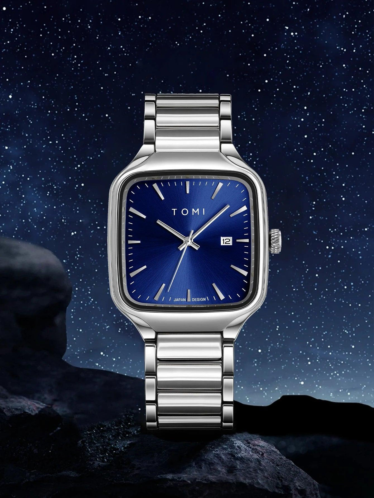 Silver watch with blue face on a starry night background