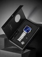 Luxury watch set with silver watch, pen, and cufflinks in a TOM FORD box on a dark background.