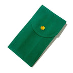 Green fabric pouch with a gold button on a white background