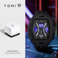 Tomi digital watch in a rugged black resin case with a digital display showing blue and gray interface elements, shown next to its white and black product box on a split background.