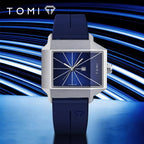 Blue watch with silver case on a blue and black striped background, featuring the TOMI brand.