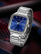 Silver watch with blue face on a dark background