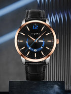 Black wristwatch with rose gold case and black leather strap on a dark background
