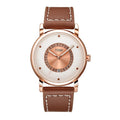 Watch with brown leather strap and rose gold casing on a white background
