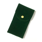 Green fabric pouch with a gold button on a white background