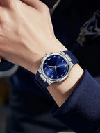 TOMI T051 navy blue watch worn on wrist, close-up view