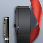 Black belt with a buckle featuring a red, white, and blue design, next to a pen on a gray background.