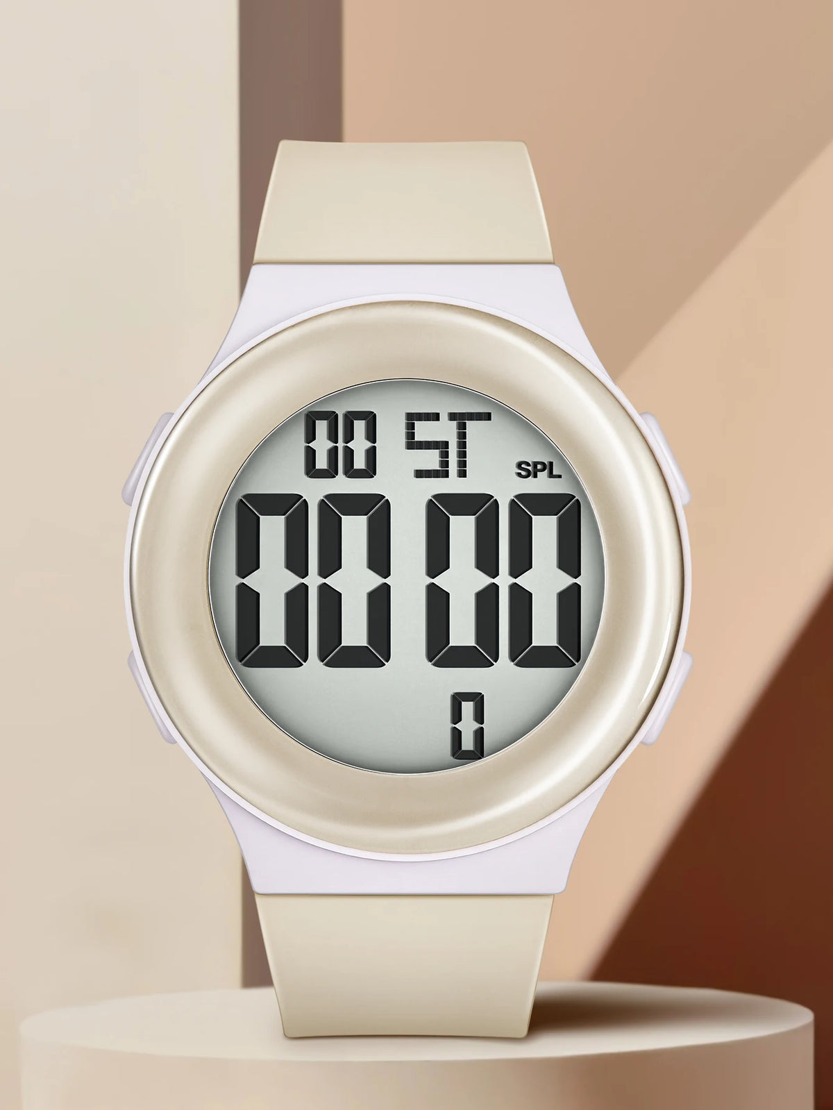 Digital watch with beige strap on a beige background
