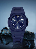 Blue wristwatch on a reflective surface with a blue gradient background