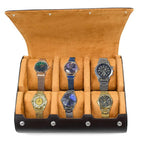 Set of five watches in a brown display case on a white background