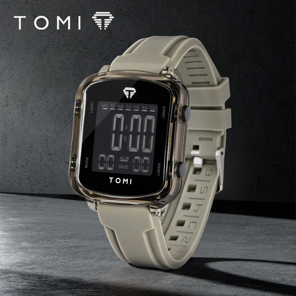 Digital watch with beige strap on a dark background, featuring the TOMI brand.