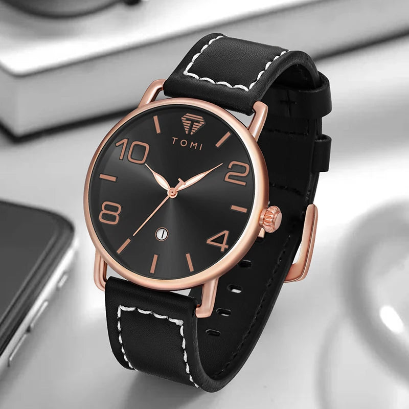 Black watch with rose gold accents on a reflective surface