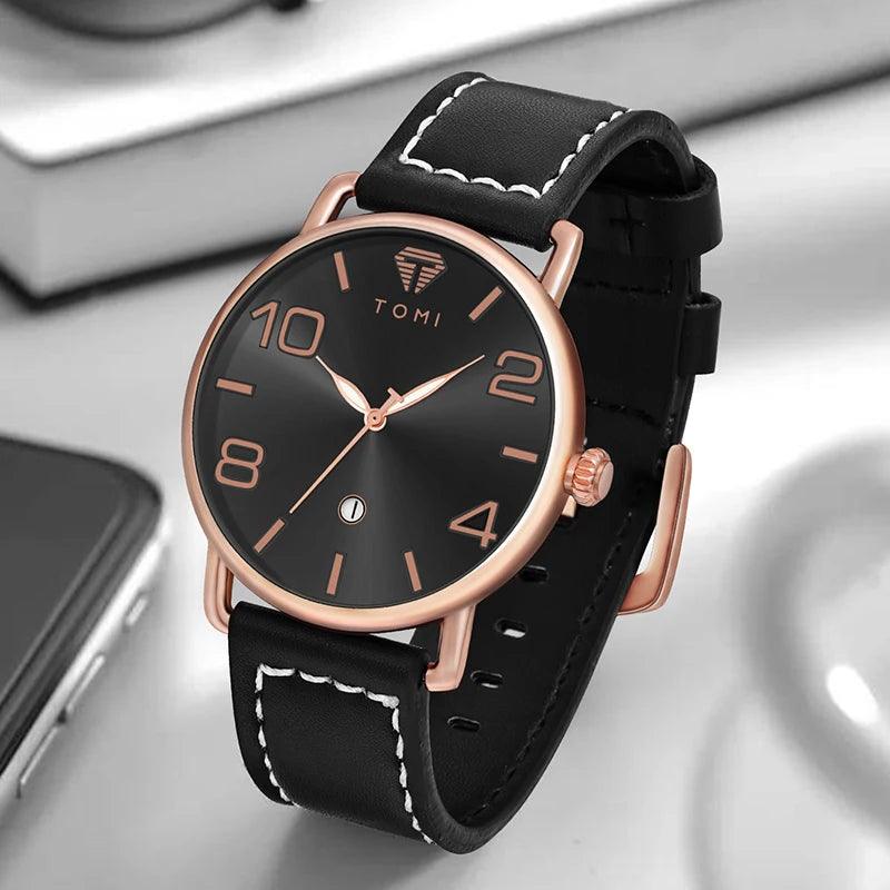 Black watch with rose gold accents on a reflective surface