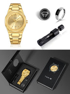 TOMI men's watch gift set featuring a gold-tone metal bracelet watch, a black and silver striped ring, a black and silver round pin, and a black watch tool, displayed alongside black branded packaging.