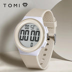 Beige digital watch with a white strap on a light gray background, featuring the brand 'TOMI'.