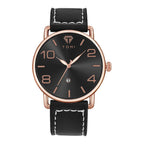 Black watch with rose gold accents on a white background