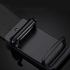 Black belt with a metal buckle on a dark background