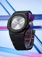 Black watch with a silver face on a colorful geometric background