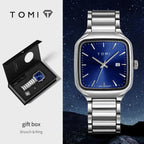 TOMI watch with blue face and silver band, gift box, brooch, and ring on a space-themed background