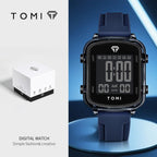 Digital watch with blue strap and TOMI branding on a blue background