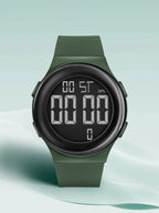 Green digital watch on a light green background