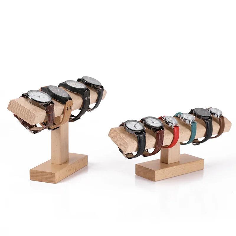 Wooden display stands holding multiple watches with different band colors on a white background
