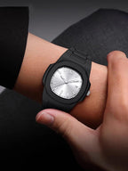 Black watch on a wrist with a dark background