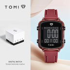Digital watch with red strap and TOMI branding on a light blue background