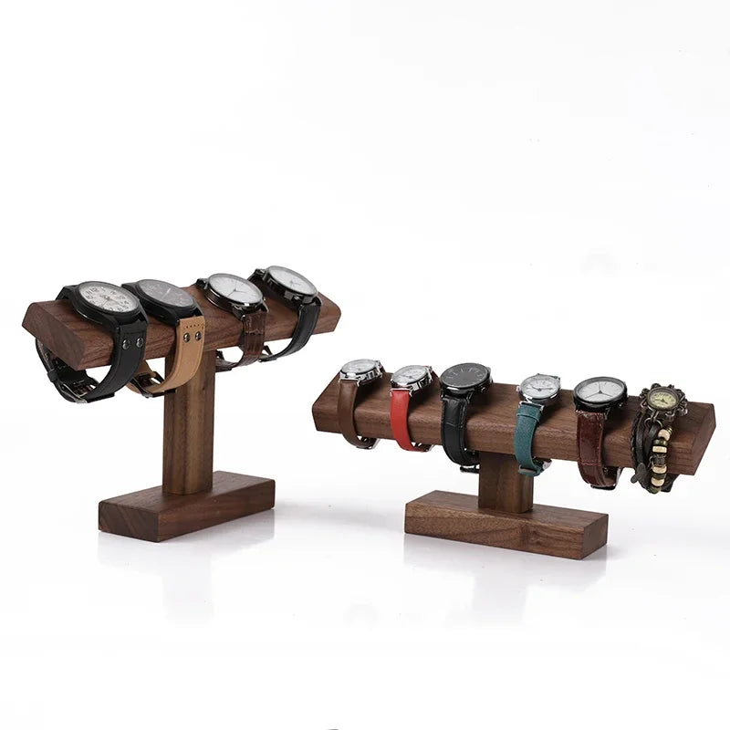 Wooden watch stand with multiple watches on a white background