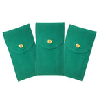 Three green fabric pouches with gold buttons on a white background