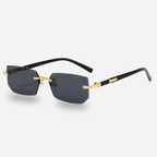 Sunglasses with black and gold frame on a white background