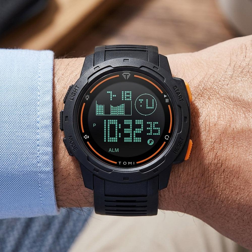 Man wearing TOMI T222B Kinetic Formula watch, Black Orange colorway